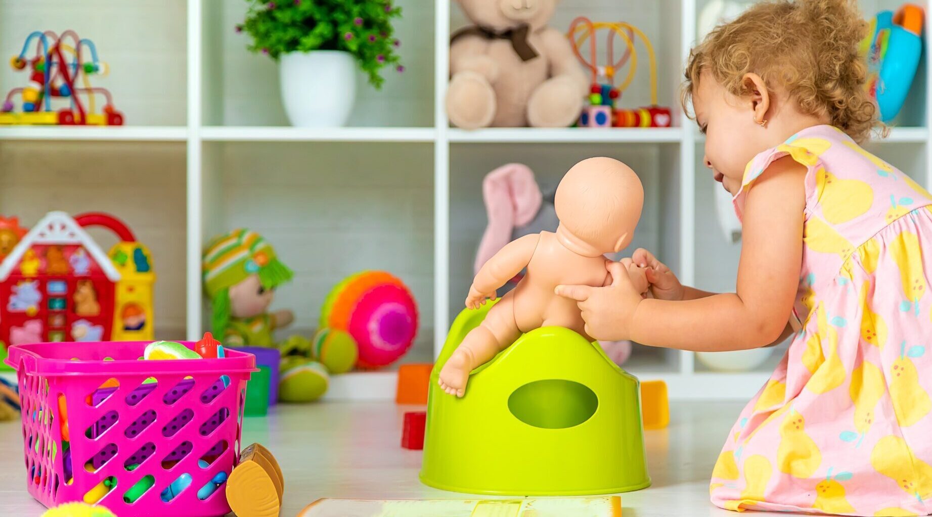 Children sit on the potty in the room. Selective focus.