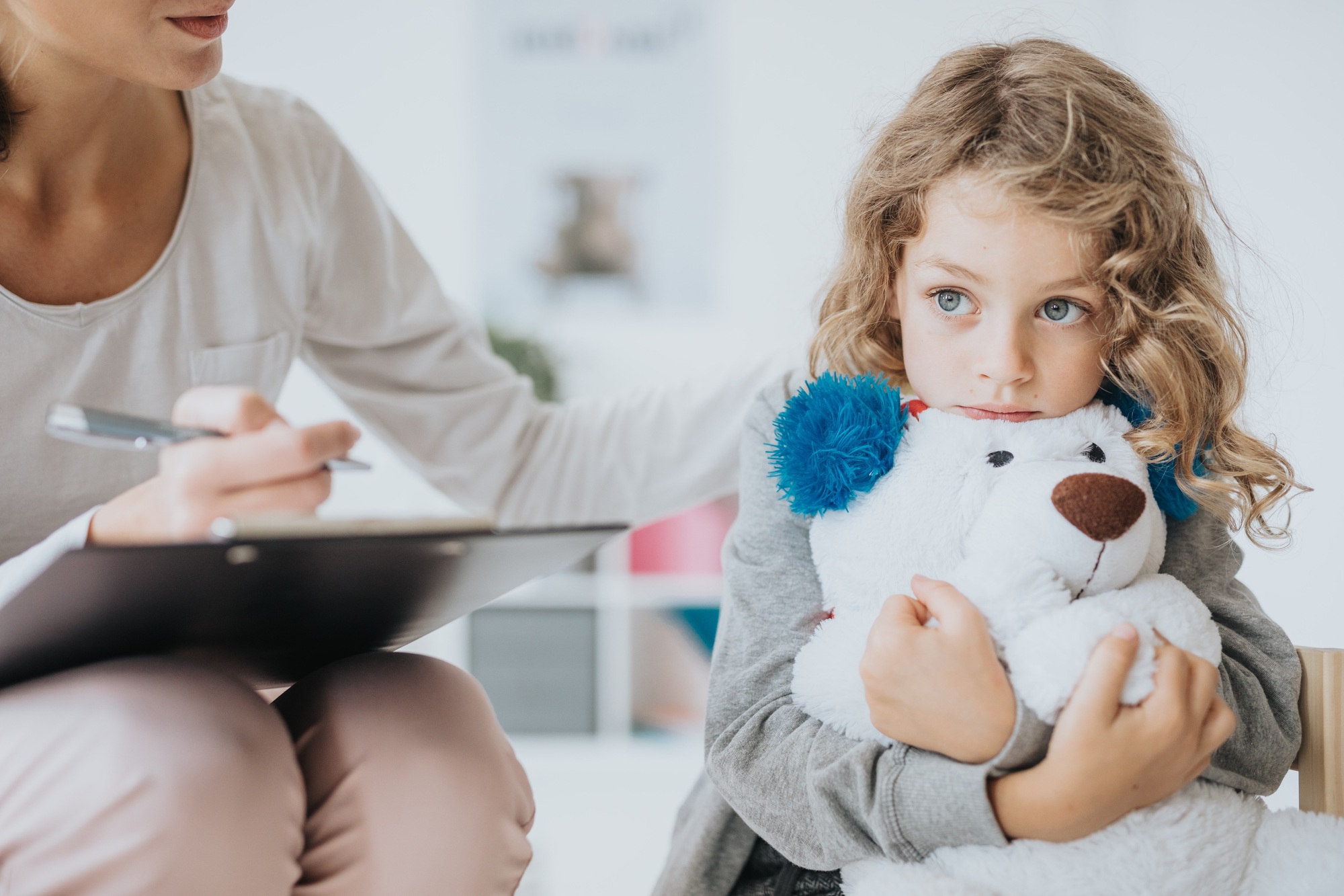 Sad boy with teddy bear