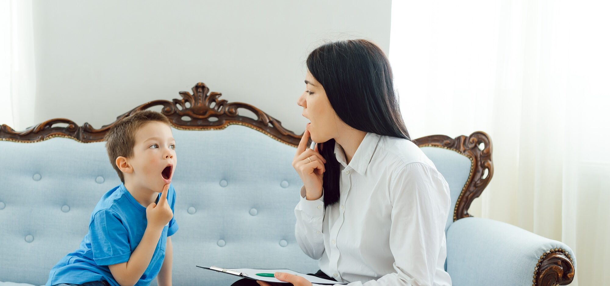 Picture of child psychologist working with young boy in office